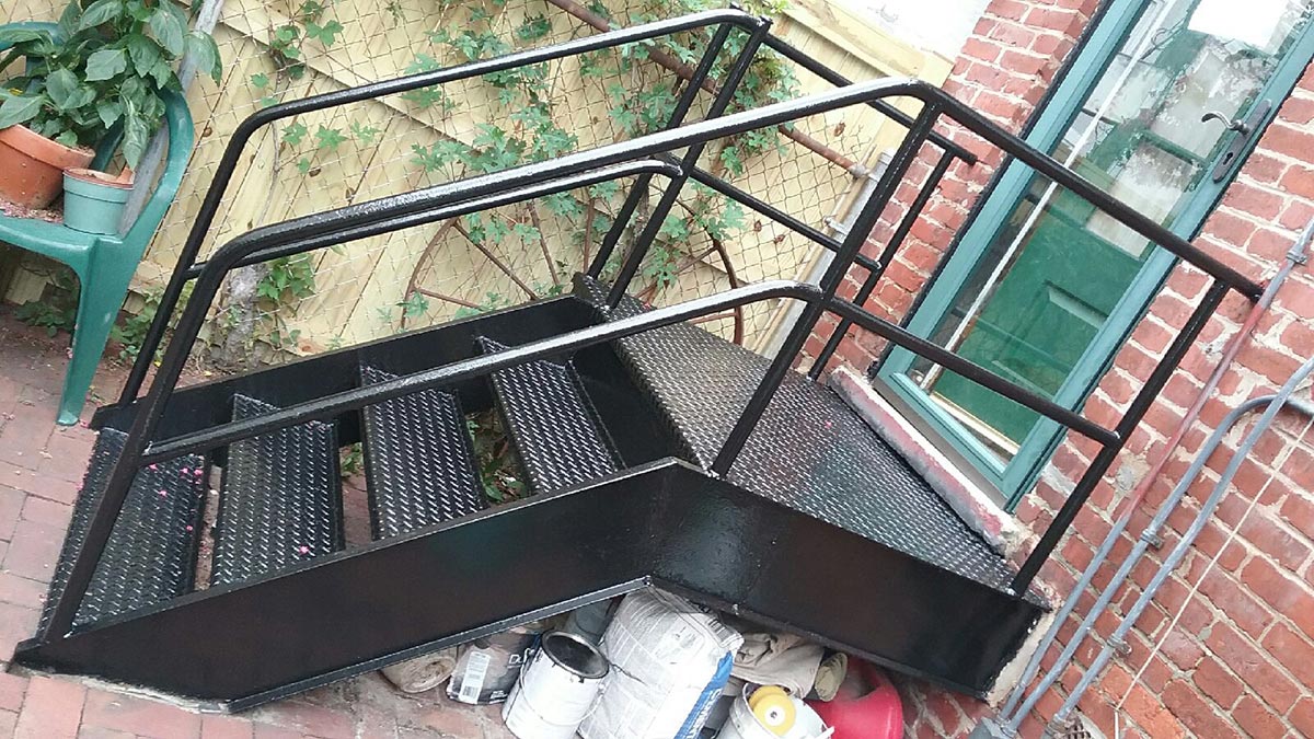 A metal staircase after painting, one of our residential painting services